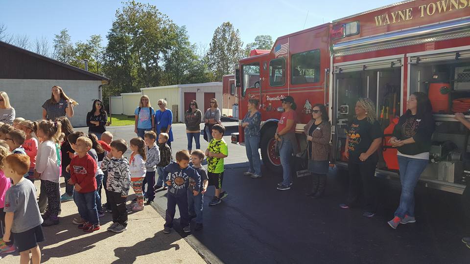 fire truck and young students
